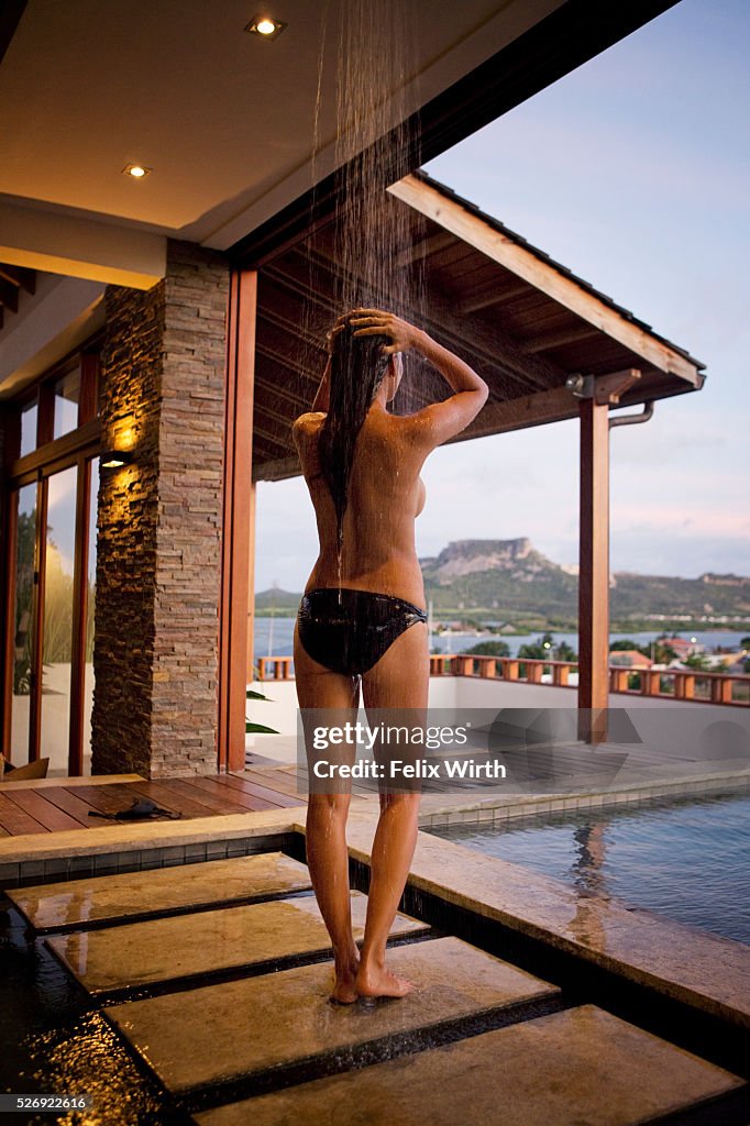 Young woman in outdoor shower