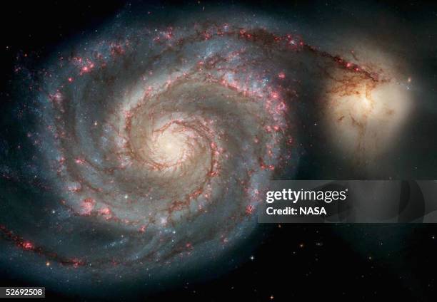 In this handout image released from the Hubble Space Telescope the Whirlpool Galaxy is seen , April 25, 2005 released for the Hubble 15th...