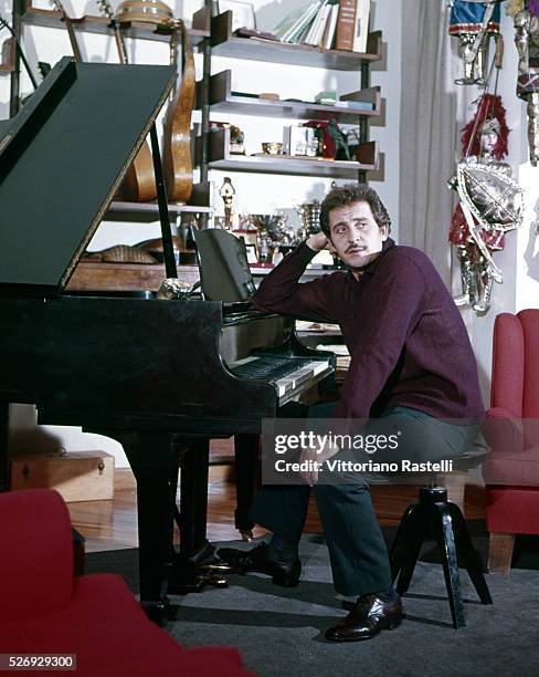 Italian singer, songwriter and actor Domenico Modugno at his home in Rome, near Ponte Milvio.