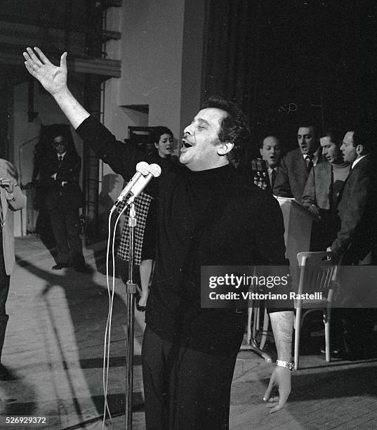 Italian singer, songwriter and actor Domenico Modugno rehearsing during the Sanremo Music Festival.