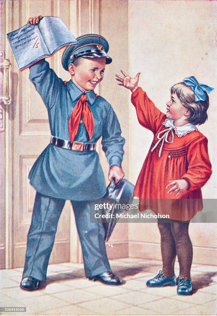 A 1960s image of a Soviet child dressed in Young Pioneer outfit with a girl