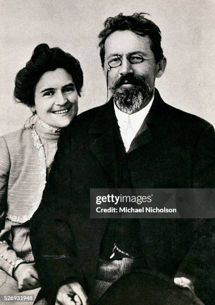 Novelist and playwright Anton Chekhov - whose works include Uncle Vanya, The Three Sisters, and The Cherry Orchard - sits beside his wife, stage...