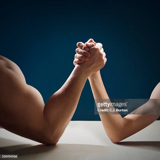 two men arm wrestling - men double stock pictures, royalty-free photos & images