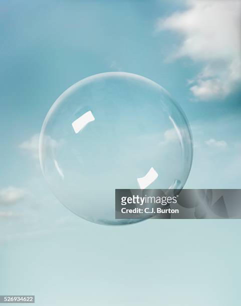 transparent sphere floating in sky - blase stock-fotos und bilder