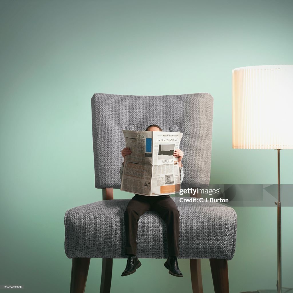 Man reading newspaper