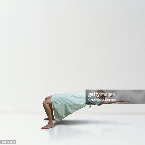 patient bending over backwards - limbo stock-fotos und bilder