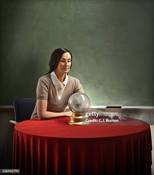 teacher staring in to crystal ball - fortune telling stock pictures, royalty-free photos & images