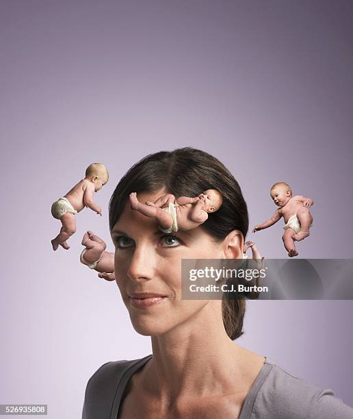 newborns spinning around woman's head - baby imagination stock pictures, royalty-free photos & images