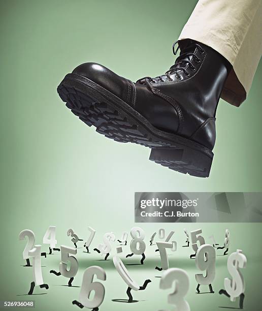 boot crushing a group of running numbers - bota imagens e fotografias de stock