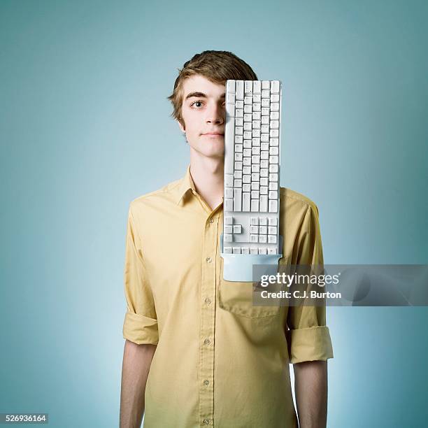 man with a computer keyboard in his pocket - shirt pocket stock pictures, royalty-free photos & images