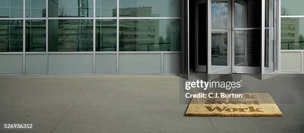 "work sweet work" doormat in front of office building - welcome mat stock pictures, royalty-free photos & images