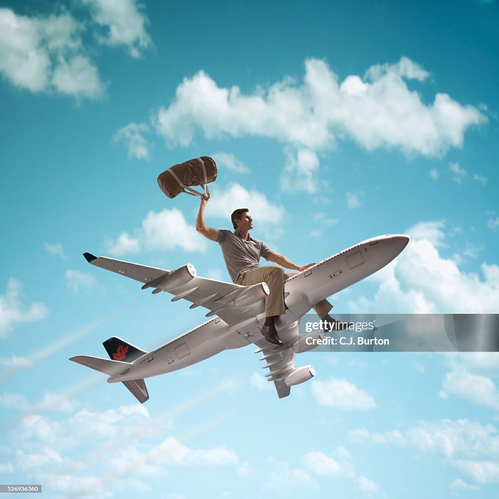 Man riding on top of a jet plane