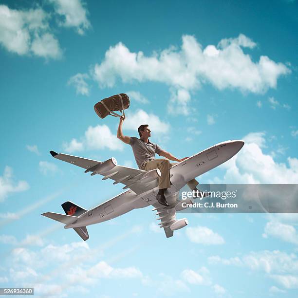 man riding on top of a jet plane - bull riding stockfoto's en -beelden