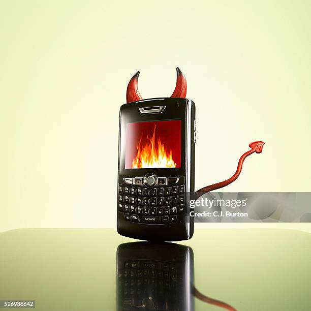 evil cell phone - devil stock pictures, royalty-free photos & images