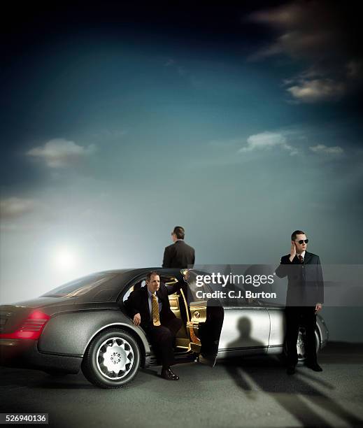 three businessmen in and around car - body guards stock pictures, royalty-free photos & images