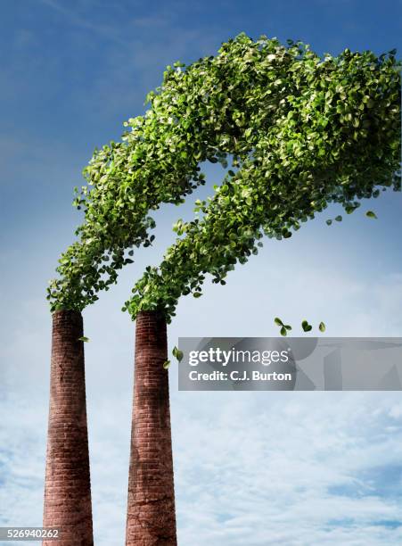smoke stacks producing green leaves instead of smoke - chimney stock pictures, royalty-free photos & images