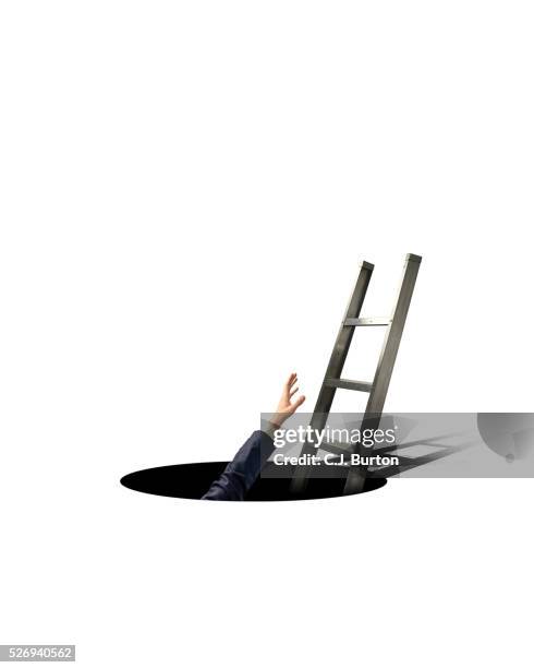 businessman's hand reaching for ladder - inside manhole stock pictures, royalty-free photos & images