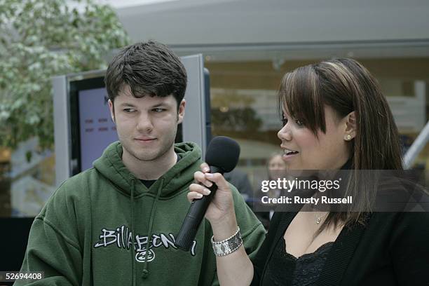 Winner Cary West considers an answer as host Kimberley Locke reads a question during taping of "Get Schooled" for The Gameshow Network April 23 2005...