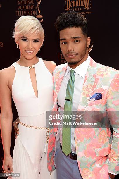 Actor Rome Flynn and model Camia Marie walk the red carpet at the 43rd Annual Daytime Emmy Awards at the Westin Bonaventure Hotel on May 1, 2016 in...