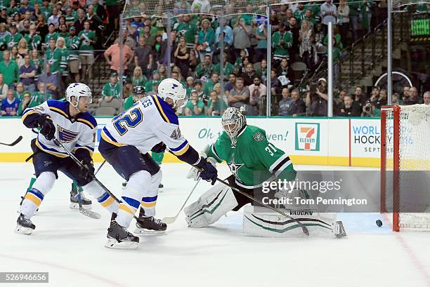 David Backes of the St. Louis Blues scores the game winning goal against Antti Niemi of the Dallas Stars in overtime in Game Two of the Western...