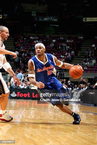 Corey Maggette of the Los Angeles Clippers drives around Jason Kidd of the New Jersey Nets during the game on March 30, 2005 at the Continental...
