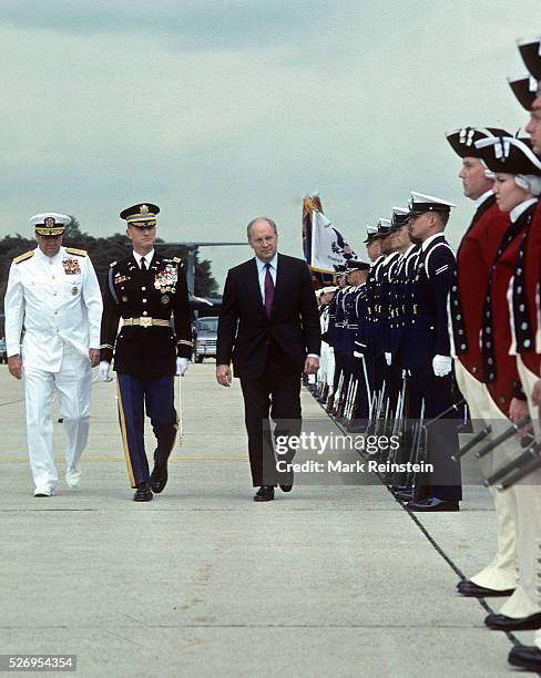 Camp Springs, Maryland. May 1989 Secretary of Defense Richard "Dick" Cheney troops the line as he reviews the members of the "Old Guard" during a...
