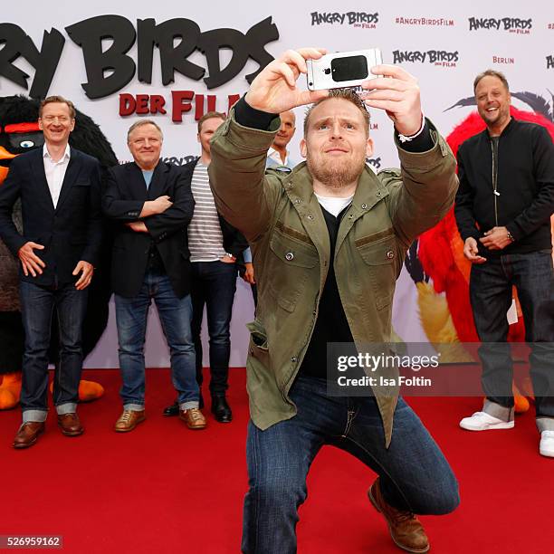 Actor Axel Stein makes a selfie during the Berlin premiere of the film 'Angry Birds - Der Film' at CineStar on May 1, 2016 in Berlin, Germany.