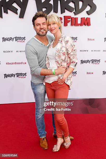 Opera star Tobey Wilson and his girlfriend Sabrina Gehrmann attend the Berlin premiere of the film 'Angry Birds - Der Film' at CineStar on May 1,...