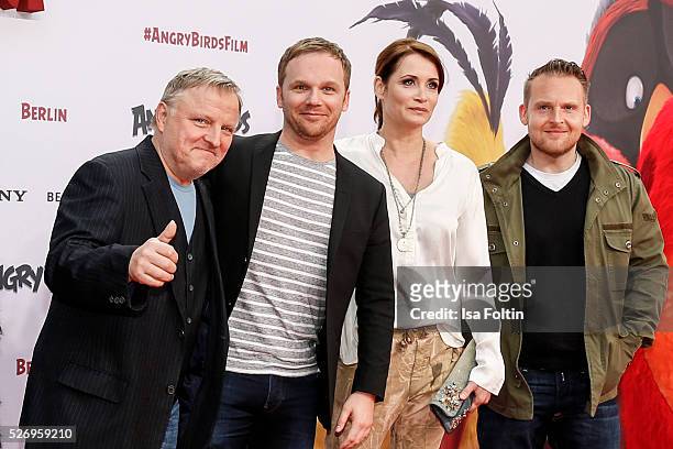 Actor Axel Prahl, moderator Ralf Schmitz, actress Anja Kling and actor Axel Stein attend the Berlin premiere of the film 'Angry Birds - Der Film' at...