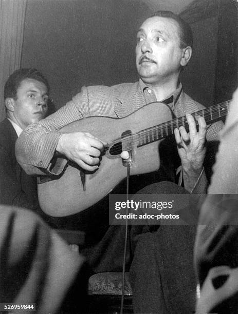 Django Reinhardt , Gypsy jazz guitarist. In 1948.