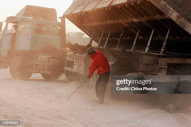 Migrants work at a highway construction site on April 25, 2005 in Feidong County of Anhui Province, East China. There has been a lot of concern for...
