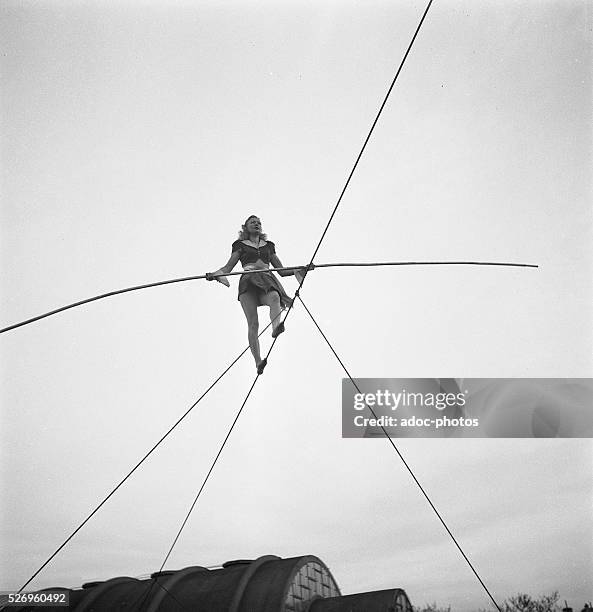 Tight Rope Playing Instruments Tightrope Artist Photos and Premium High Res Pictures - Getty Images