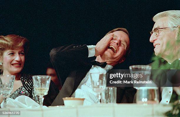 Washington, DC. 4-29-1989 President George H.W. Bush attending the annual White House Corrsepondents Association Dinner, laughs as Impressionist Jim...