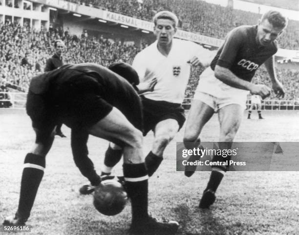 Russian goalkeeper Lev Yashin is charged by England player Derek Kevan during the England-Russia World Cup match at Gothenburg, Sweden, 9th June 1958.