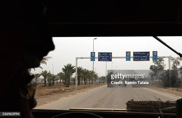 Soldiers from the Fighting 69, a New York National Guard unit, patrol Route Irish, the highway between Baghdad International Airport and central...