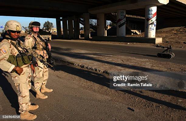 Soldiers from the Fighting 69th, a New York National Guard unit, shut down Route Irish, the highway between Baghdad International Airport and central...