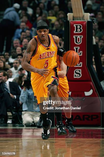 Josh Smith of the Atlanta Hawks moves the ball against the Chicago Bulls on March 21, 2005 at the United Center in Chicago, Illinois. The Bulls won...