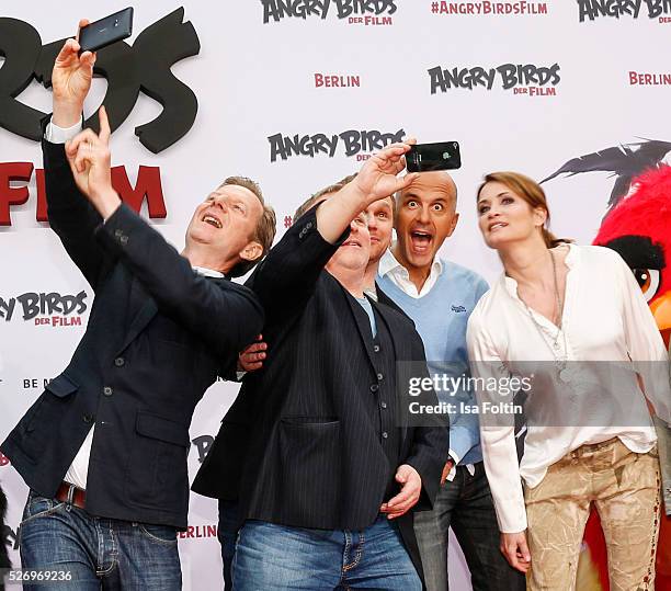 The actors Michael Kessler, Axel Prahl, Ralf Schmitz, Christoph Maria Herbst and Anja Kling make a selfie during the Berlin premiere of the film...