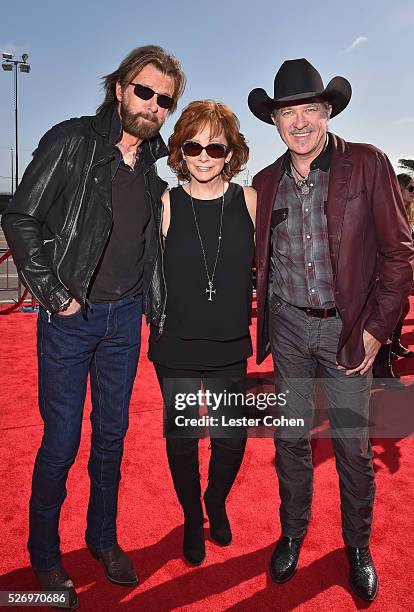 Singers Ronnie Dunn and Kix Brooks of Brooks & Dunn, with singer Reba McEntire , attend the 2016 American Country Countdown Awards at The Forum on...