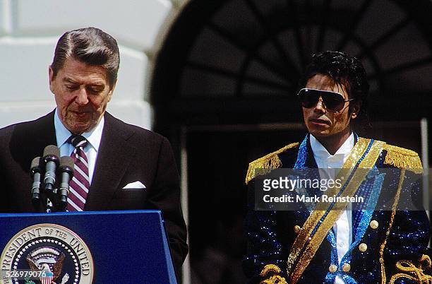 Washington, DC. 5-14-1984 Michael Jackson with President Ronald Reagan and FIrst Lady Nancy Reagan at ceremony on the South Lawn of the White House...