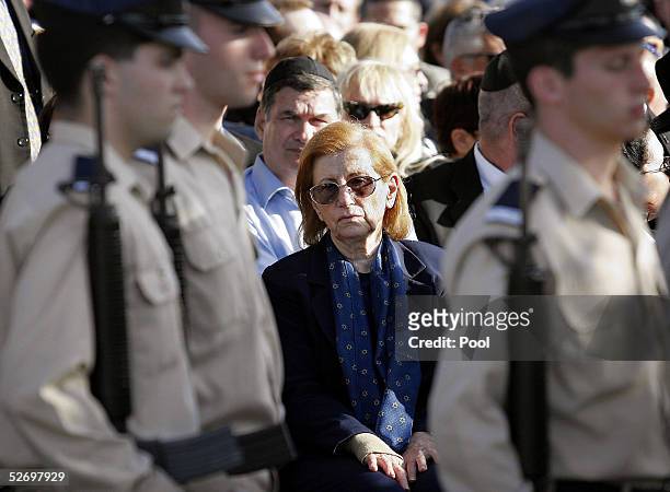 Reuma Weizman, widow of former Israeli President Ezer Weizman, is framed between Air Force soldiers during Ezer Weizman's state funeral April 26,...