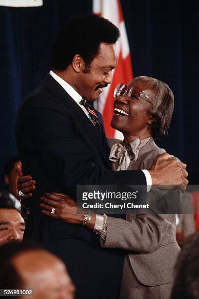 Baptist minister and civil rights activist Jesse Jackson hugs former New York congresswoman Shirley Chisholm after announcing his candidacy for the...