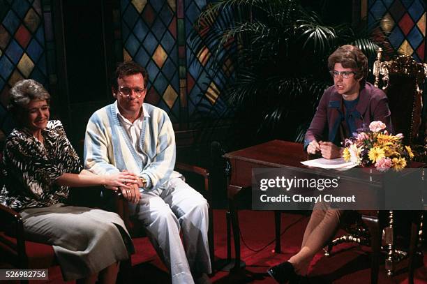 Dana Carvey, right, plays the Church Lady in a sketch with Jim and Tammy Faye Bakker- played by Phil Hartman and Jan Hooks.