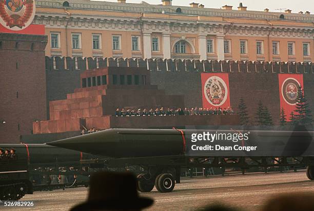 Military unit passes before Communist leaders assembled on top of the Lenin Mausoleum to review the May Day parade.