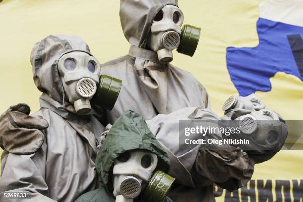 Greenpeace activists wearing chemical suits protest outside the IAEA building April 26, 2005 in Moscow, Russia. The protest was set to coincide with...