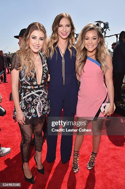 Singers Madison Marlow and Taylor Dye of Maddie & Tae, with singer Olivia Lane, attend the 2016 American Country Countdown Awards at The Forum on May...