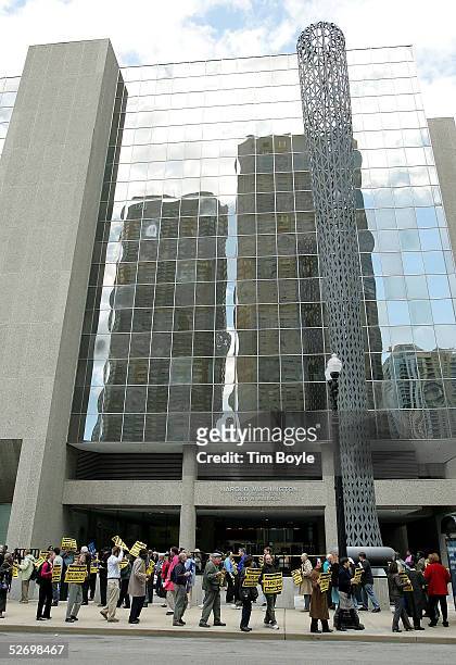 Protesters rally in front of the Social Security Administration office April 26, 2005 in Chicago, Illinois. Activists gathered at the downtown office...