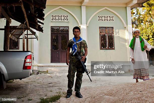 Volunteer paramilitary guards the I Payae village in Narathiwat. The Al Foukhran mosque was attacked by militants who filled the mosque with gunfire....