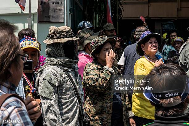 Anti-government protesters converge on suburb of Banglamphu which caters to the backpacker tourist market. PDRC guards were in camoflage with faces...