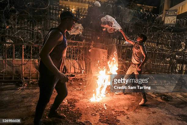 Demonstrators burn garbage outside the Serail, the main government headquarters, in downtown Beirut, Lebanon as part of the ongoing "YouStink"...